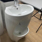 White Wudu Basin in a shop setting with other products in the background. 